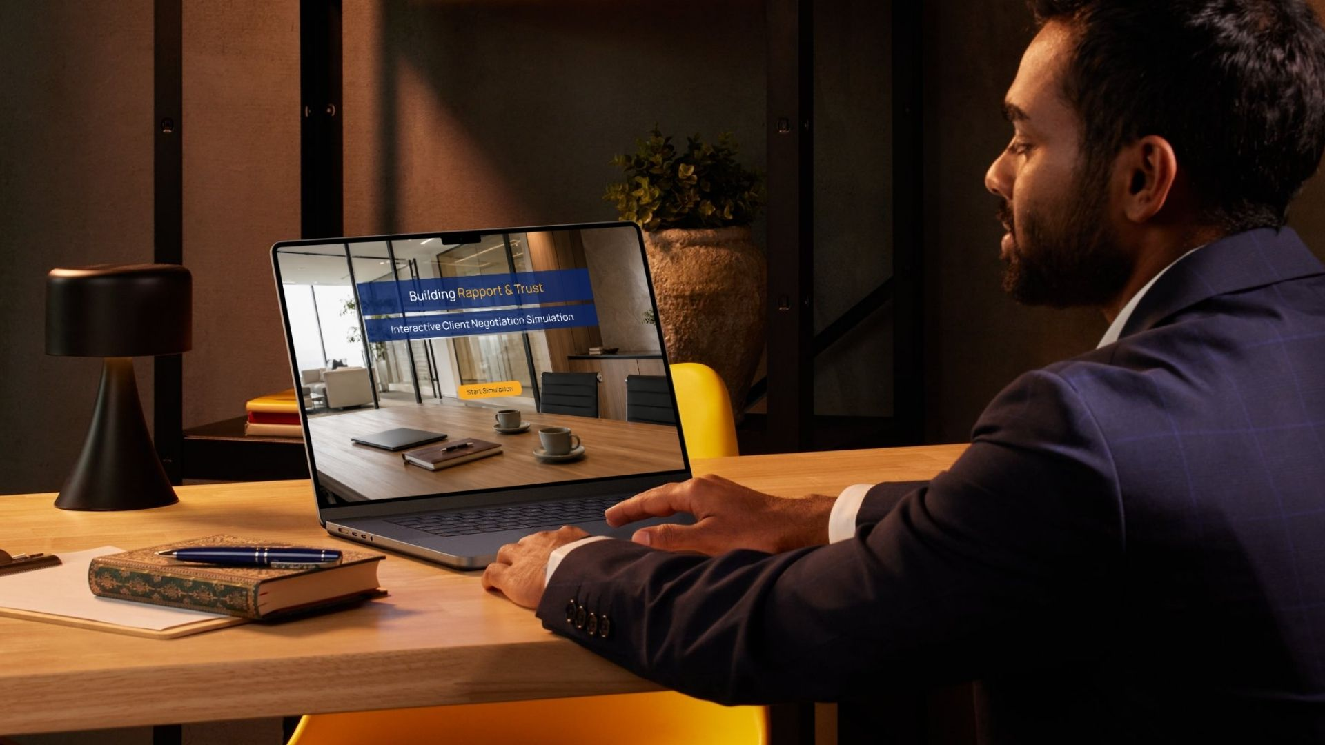 Professional seated at a desk viewing the Building Rapport and Trust negotiation simulation on a laptop