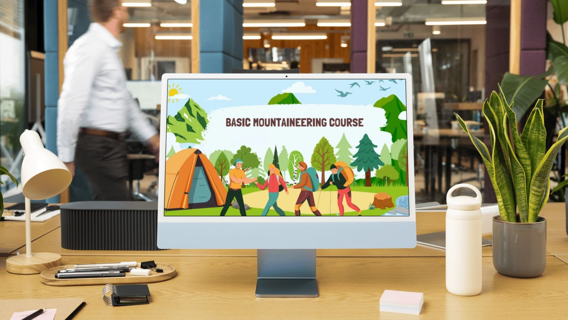 Desktop monitor displaying the Basic Mountaineering Course with illustrated hikers, tents, and mountain scenery
